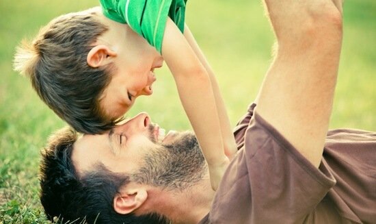 dad play with son outdoor at park