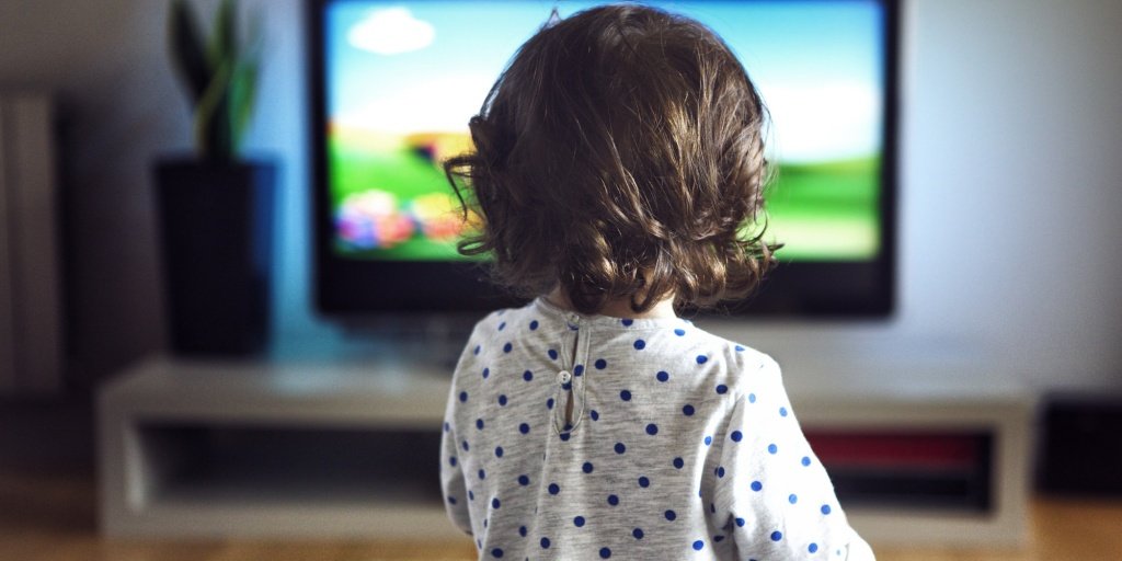 Little girl watching tv