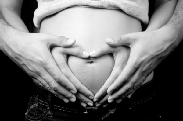 Love and pregnancy concept - pregnant woman and husband