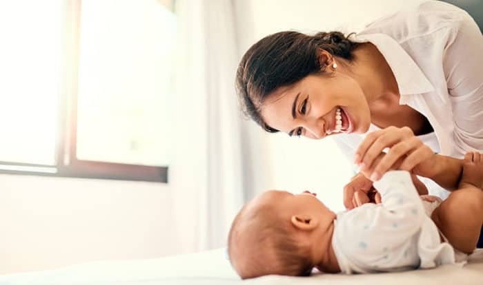 Shot of a happy mother bonding with her baby boy at home